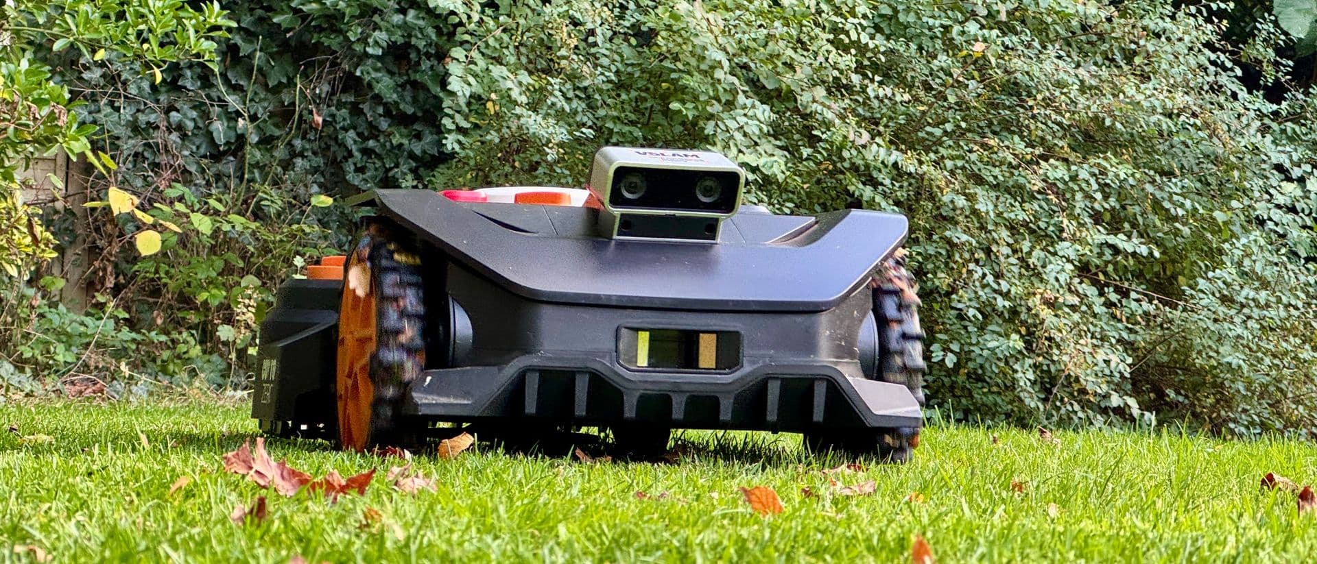 Worx Landroid Vision Cloud WR306E robot lawn mower on grass with green background