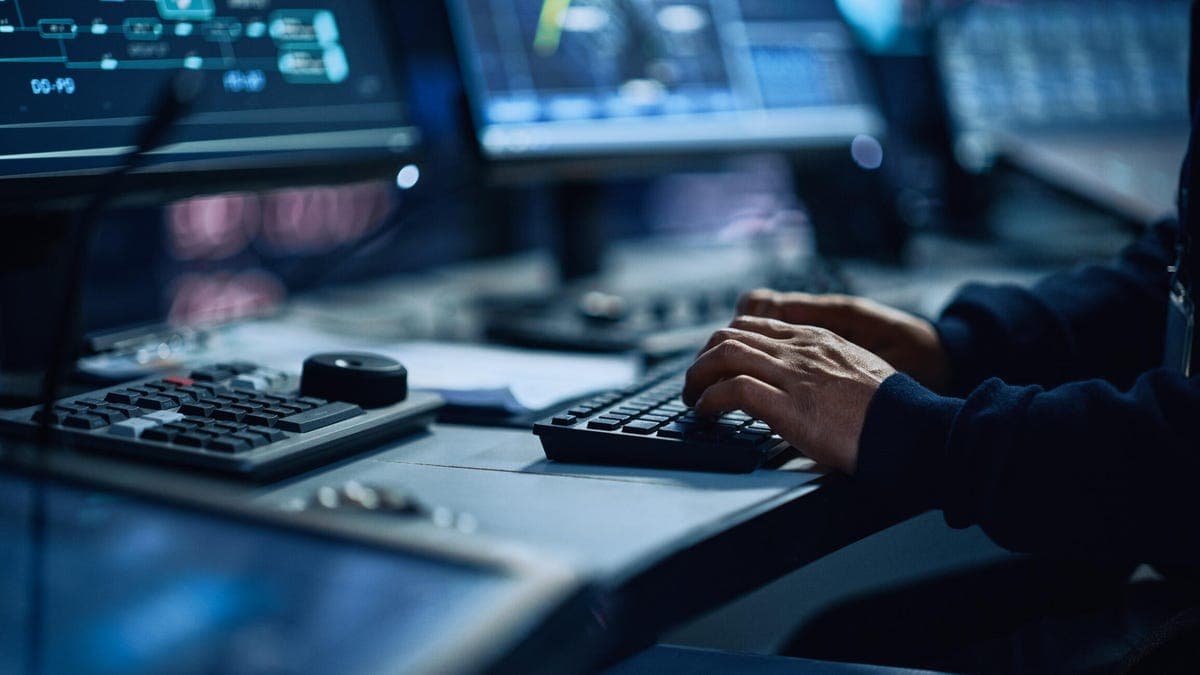 Cybersecurity professionals collaborating in a modern security operations center.