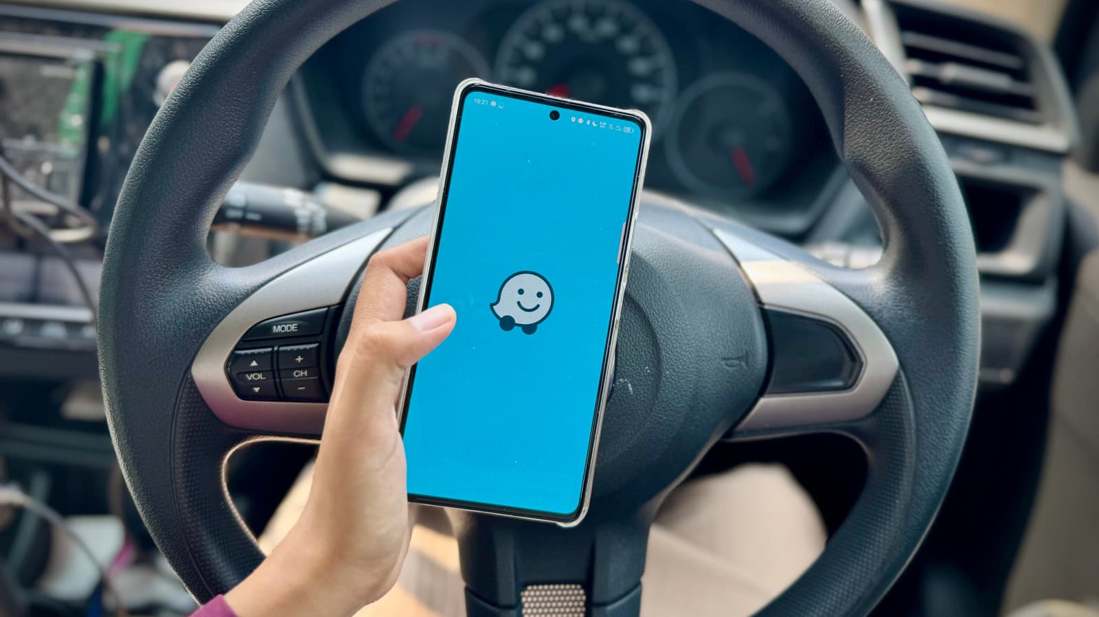 Waze navigation map showing traffic alerts on a smartphone screen in a European city setting