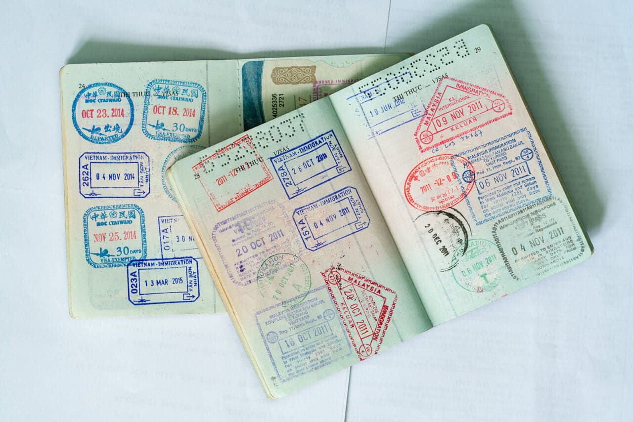 Digital illustration showing an Estonian ID card design next to an abstract robot silhouette representing AI agent registrati