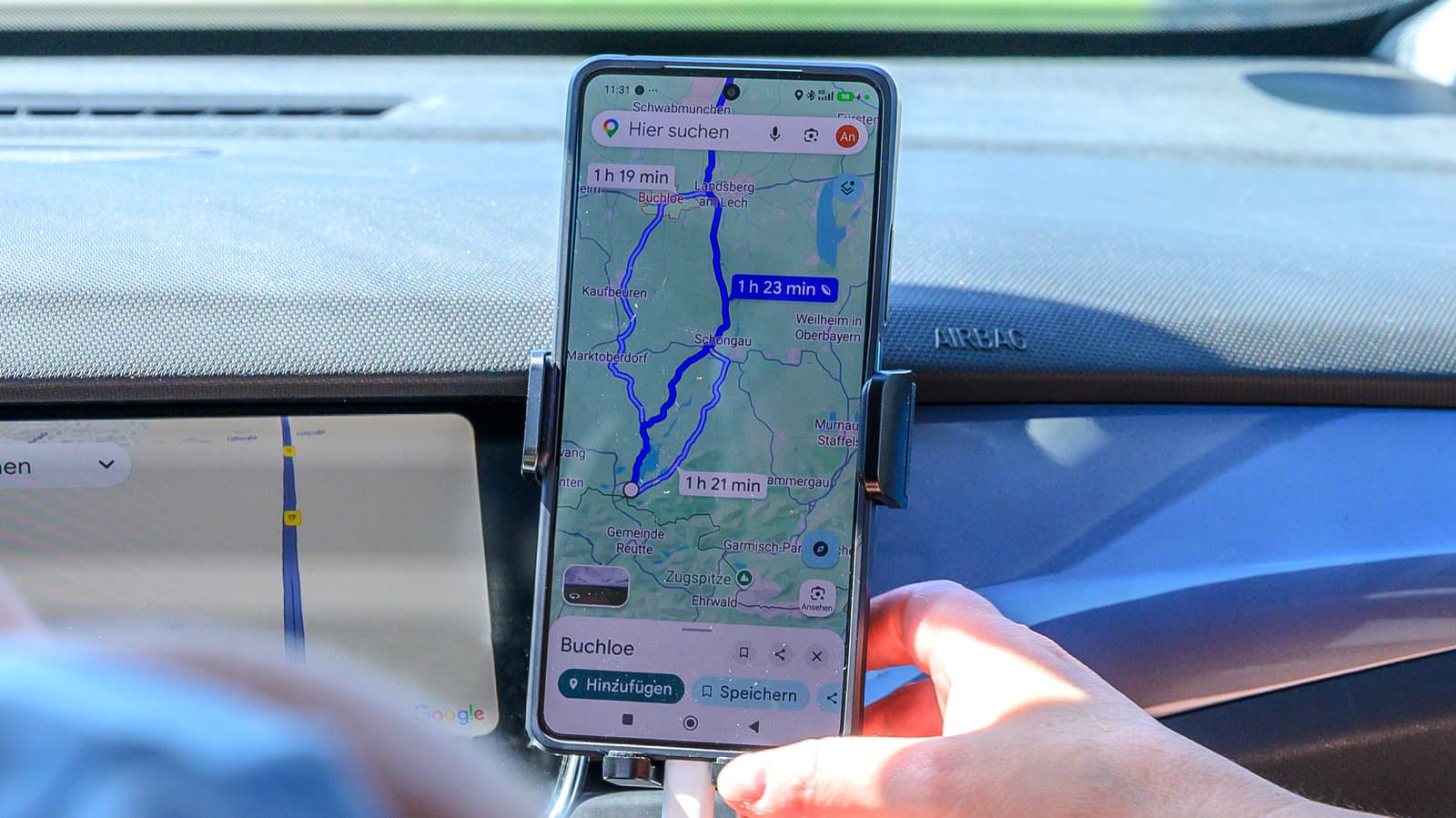 Screenshot of Google Maps showing a dark blue driving route on a city street map