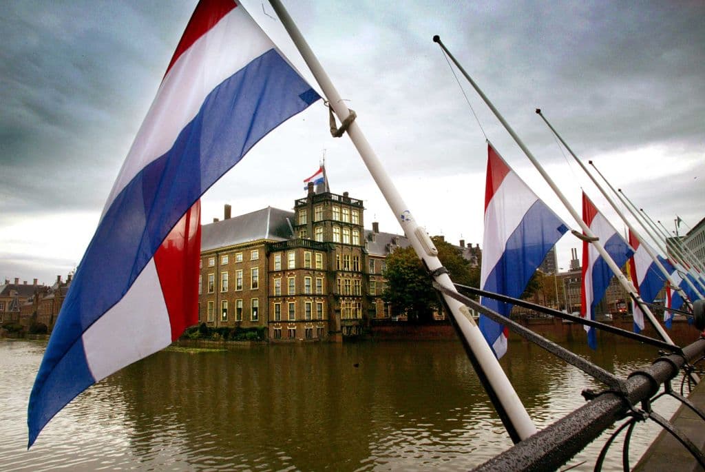 Dutch tax authority office building with digital network overlay symbolizing open source transition