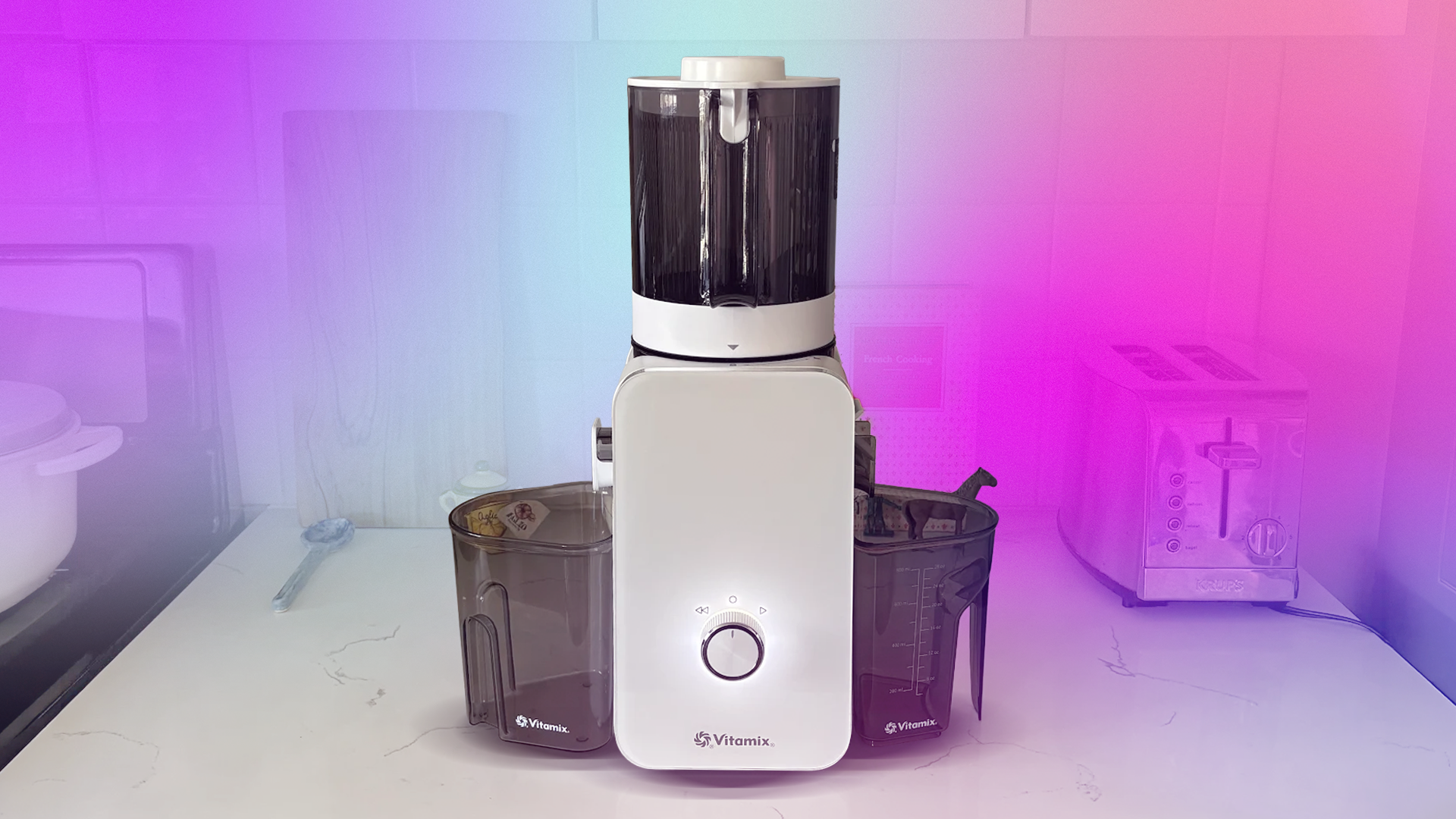 Close-up of Vitamix's first juicer on a kitchen counter showing its stainless steel auger and pulp container