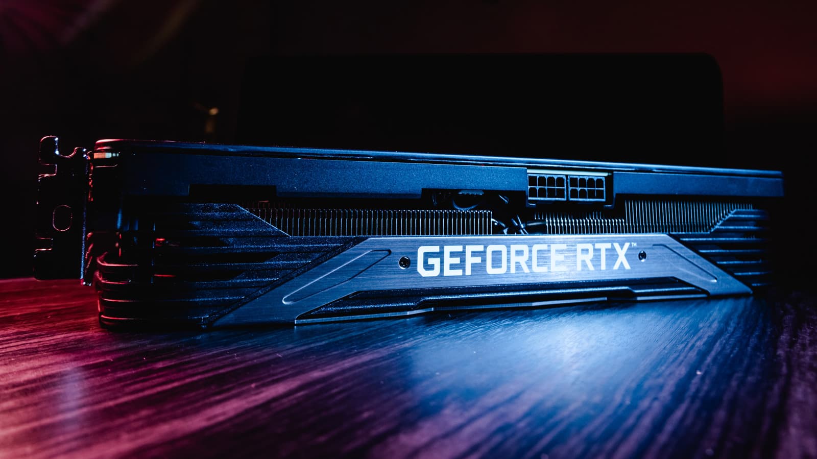 Nvidia GeForce RTX graphics card with glowing green LED and fan visible