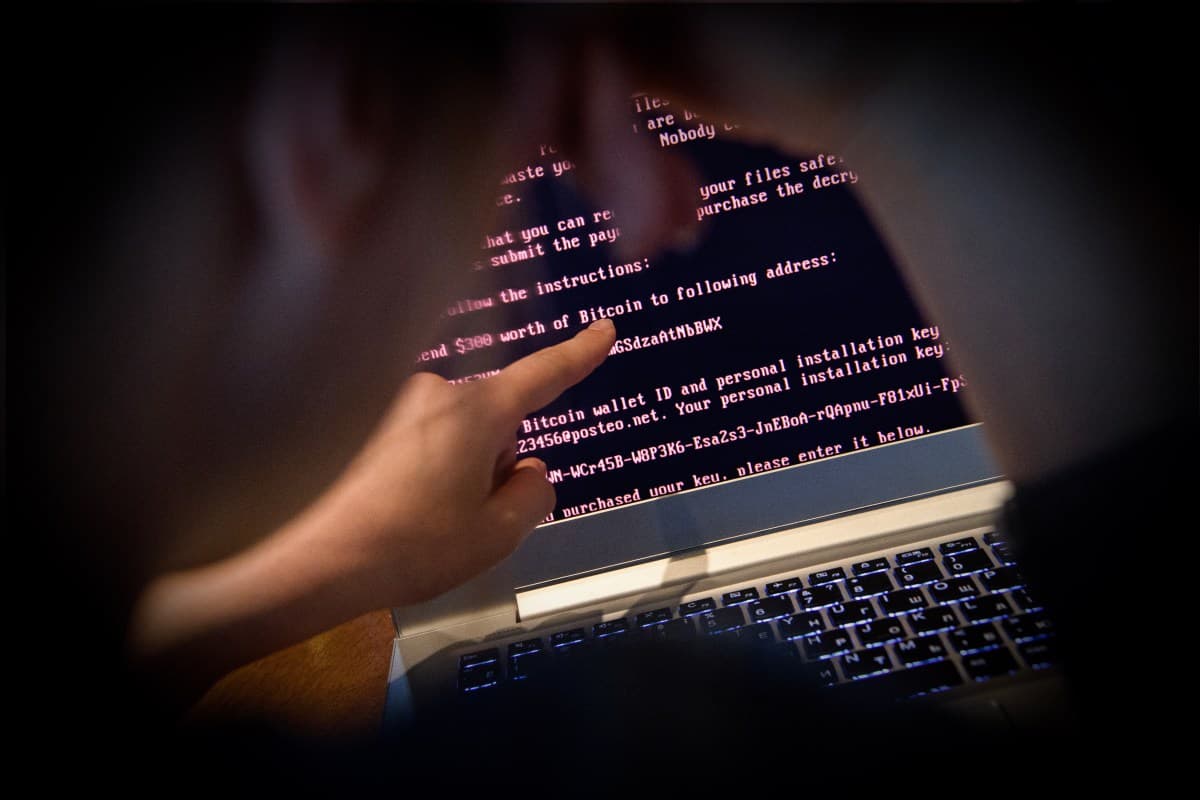 Cybersecurity concept showing ransomware attack sequence with hacker and victim data