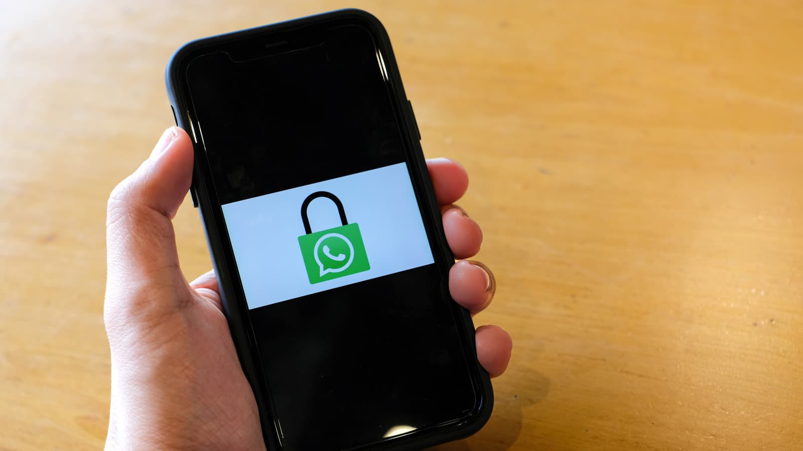 A smartphone screen showing a text message conversation with a small lock icon next to a blue chat bubble.