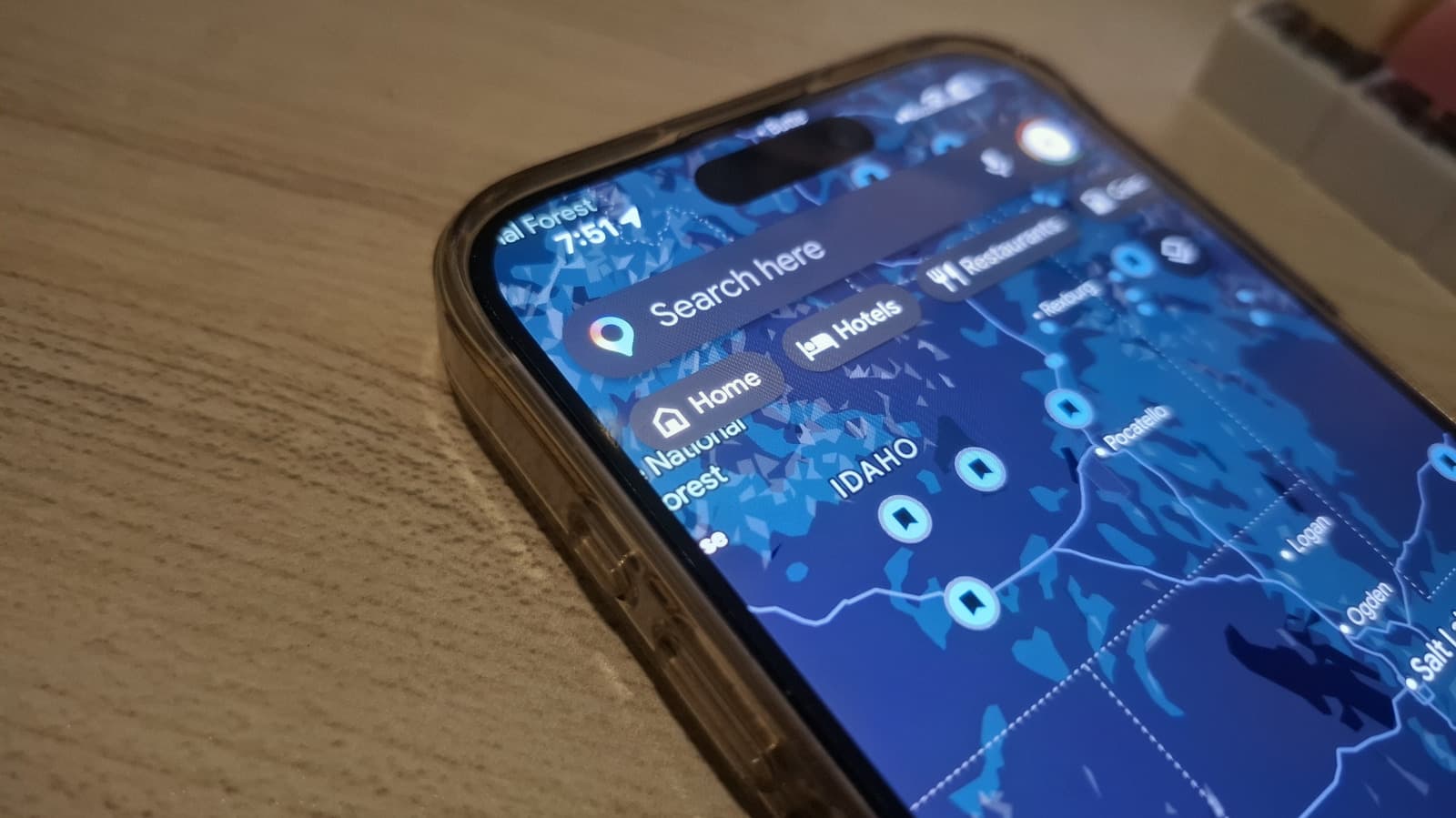 Person using Google Maps on a smartphone to set home location for better navigation