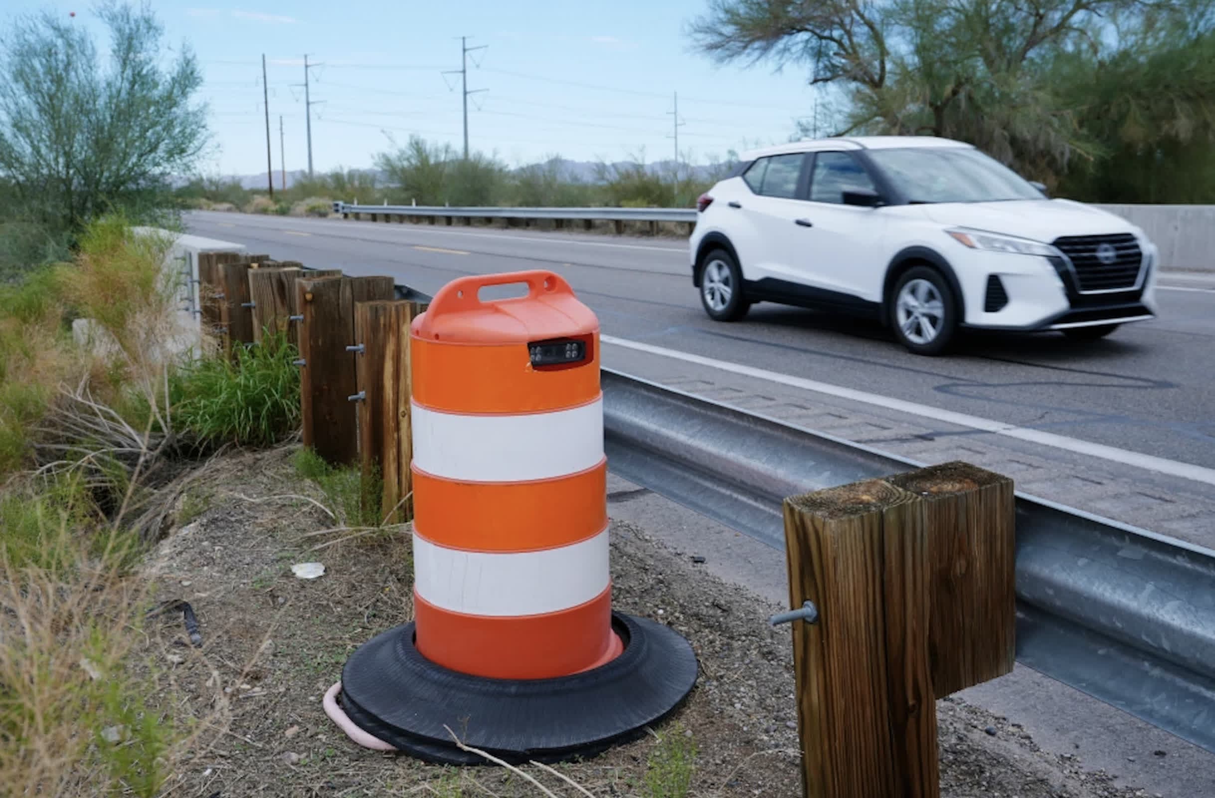 A Flock Safety license plate camera mounted on a pole in a residential area of Roseville, California