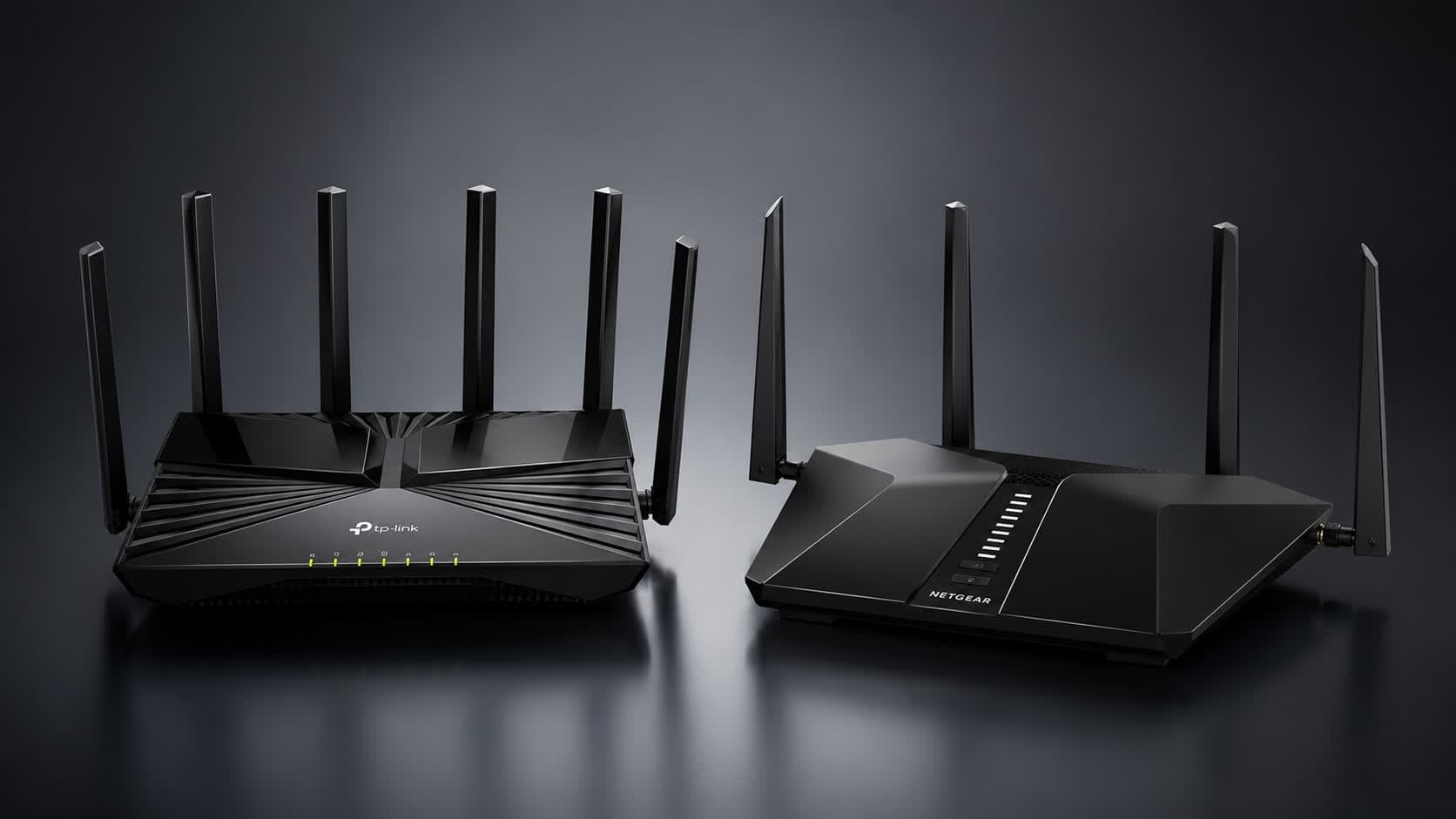 Netgear and TP-Link router boxes side by side on a shelf in an electronics store
