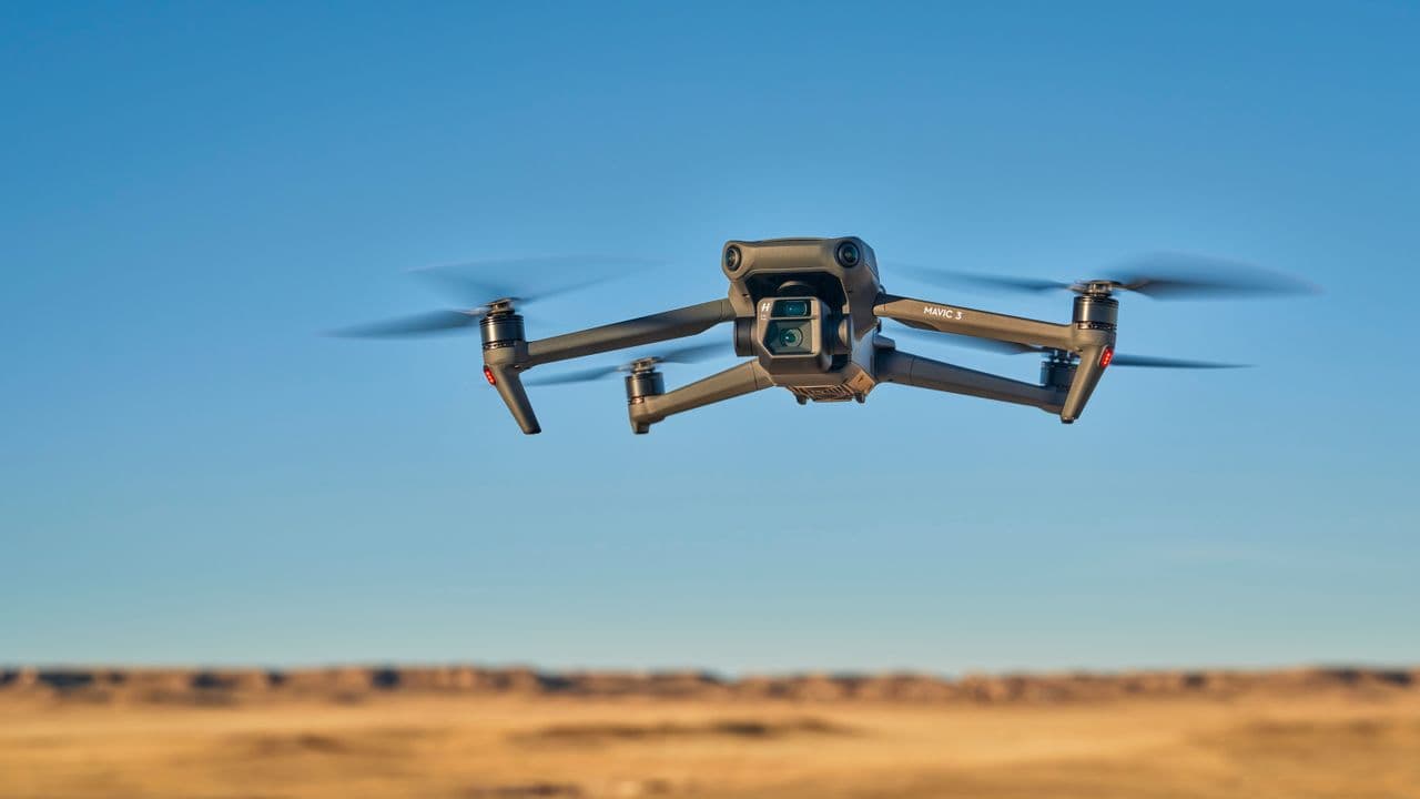 A drone with LiDAR sensors flying against a blue sky, representing FCC's proposed ban on foreign-made drones with obstacle av