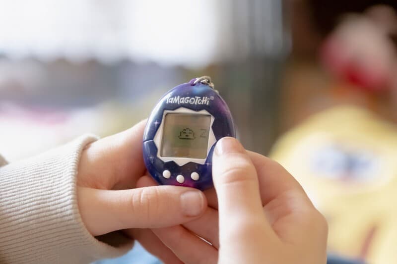 Meta Muse Charm AI handheld companion device compared to Tamagotchi size