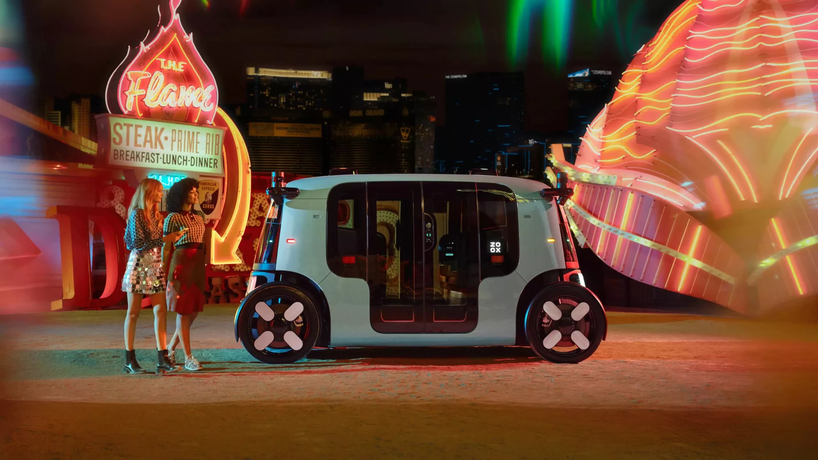 Zoox bidirectional robotaxi in San Francisco street scene with passengers inside