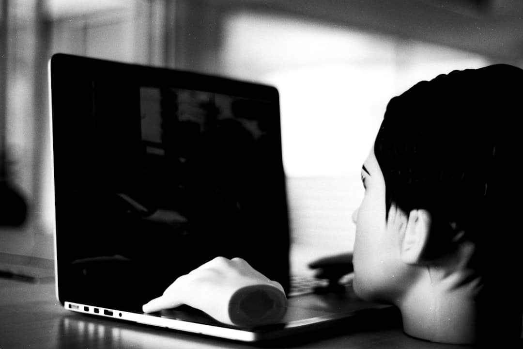 A person looking at a computer screen showing a profile page with AI-generated text about their life