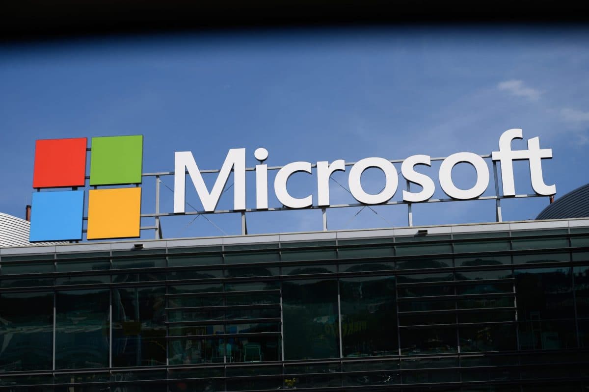 Microsoft logo on building facade representing corporate technology expansion into artificial intelligence.