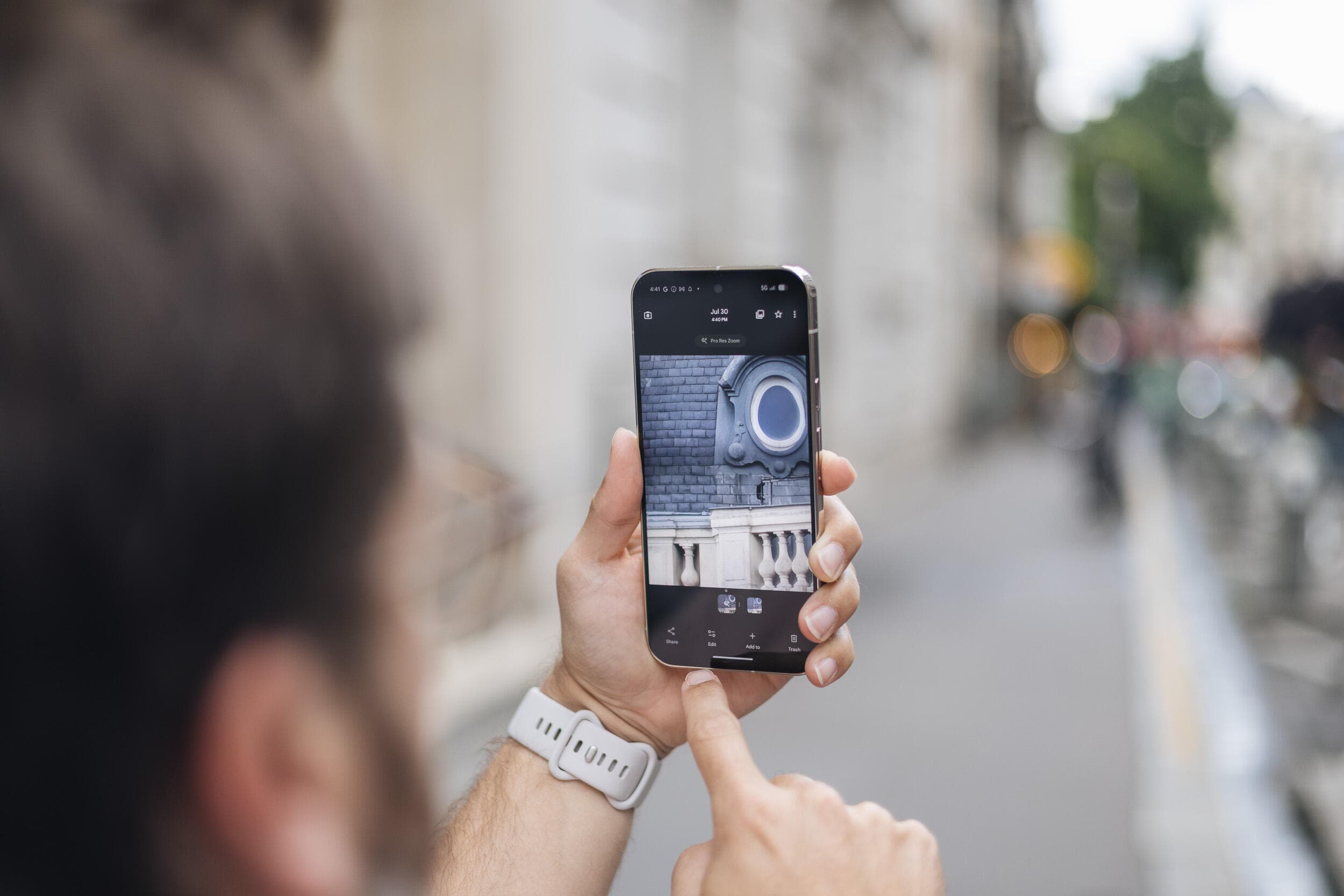 Google Pixel smartphone displaying a photo with AI-enhanced editing tools like Magic Eraser and Real Tone adjustments