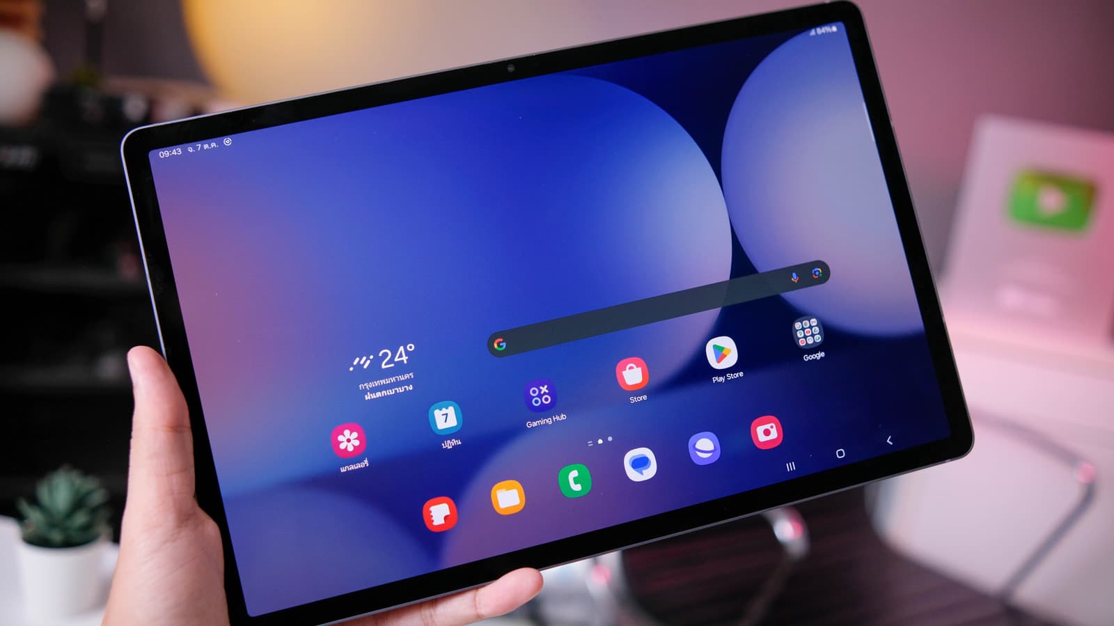 Galaxy tablet with S Pen stylus and colorful app icons displayed on screen