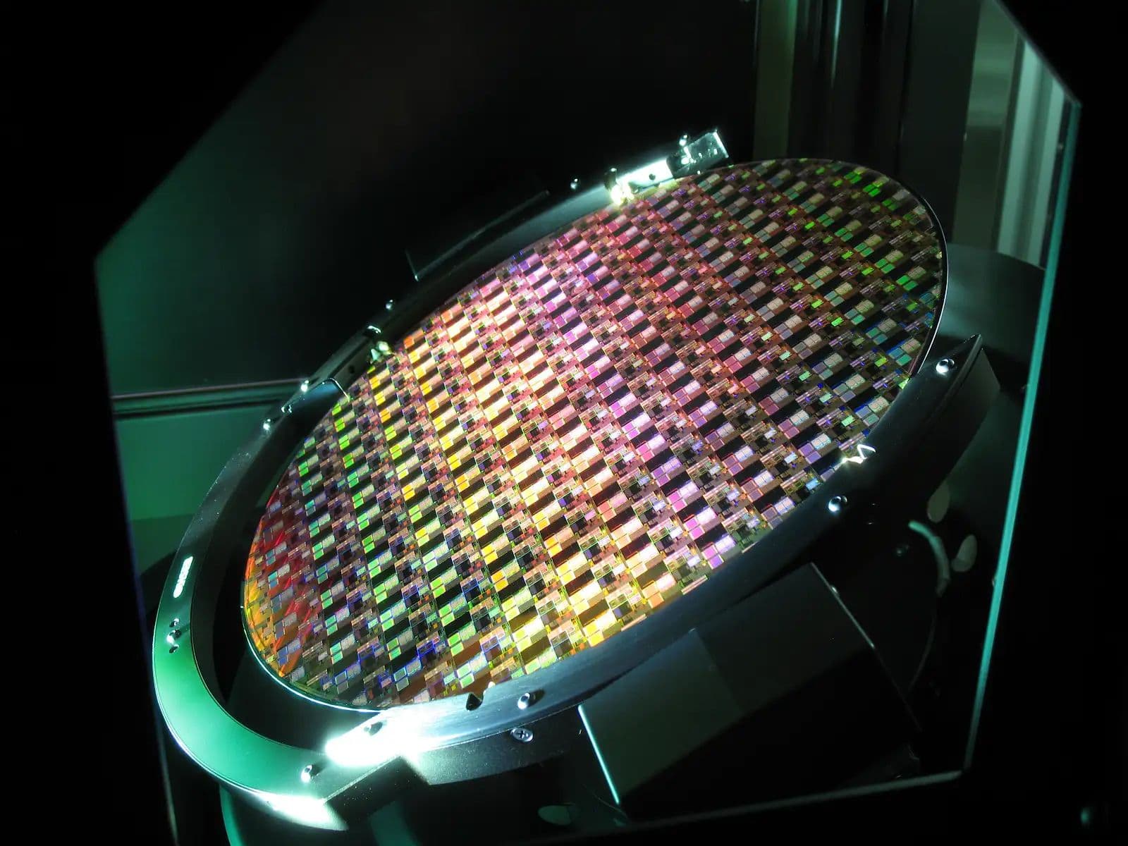 Close-up of memory chips and semiconductor wafer with circuit patterns