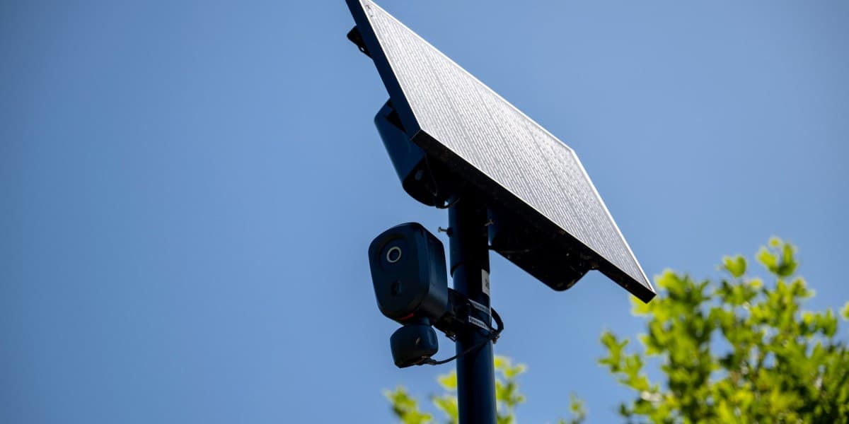 Automatic license plate reader camera mounted on a pole in a city street