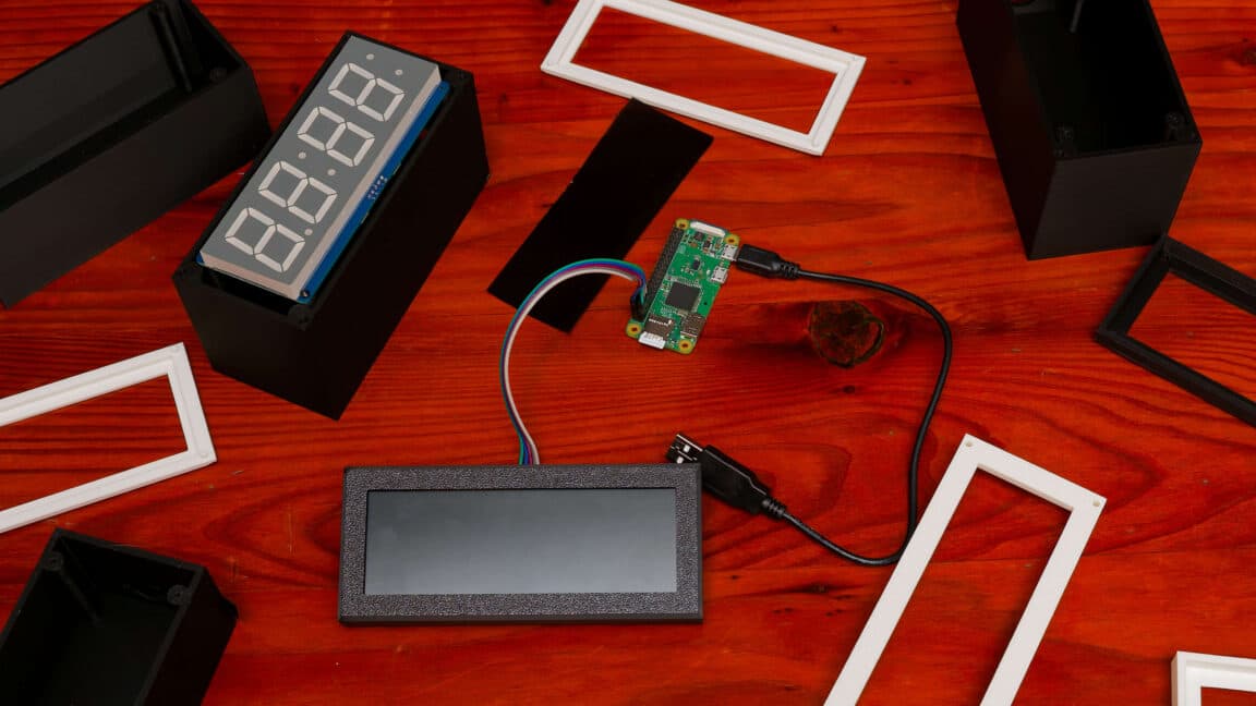 A custom-built self-setting clock with a red seven-segment display and radio antenna