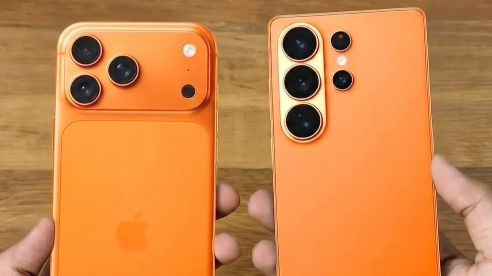Apple iPhone and Samsung Galaxy phones side by side on a table with warranty documents