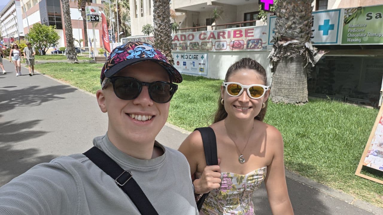 A pair of Meta smart glasses worn outdoors, highlighting the camera module and sunglass design