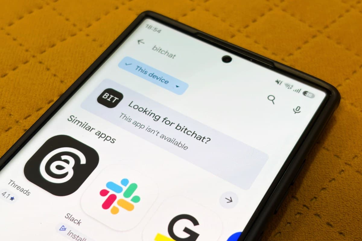 Jack Dorsey's Bitchat app icon on a smartphone screen with Indian flag background