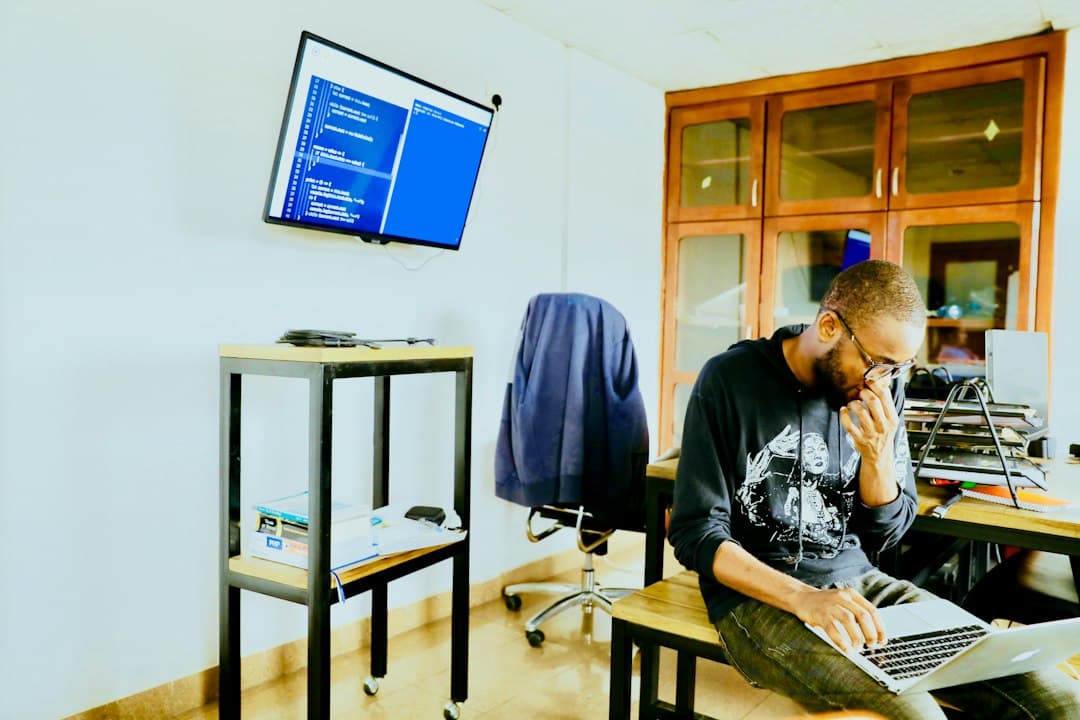 A senior engineer presenting a self-initiated project plan to a team in a modern office