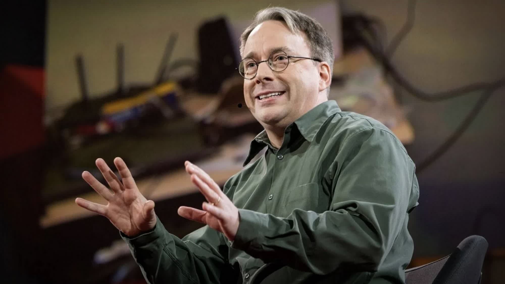 Linus Torvalds speaking at a technology conference about Linux kernel development