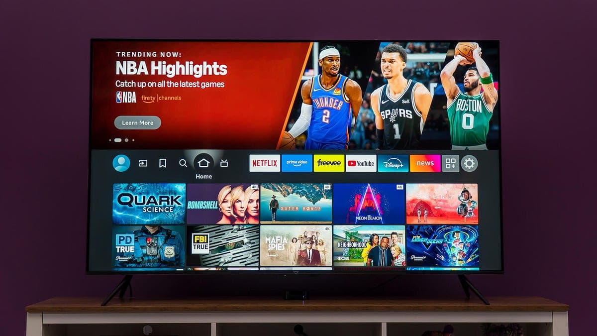 A smart TV connected to a Wi-Fi router with a VPN shield icon overlay representing network security.