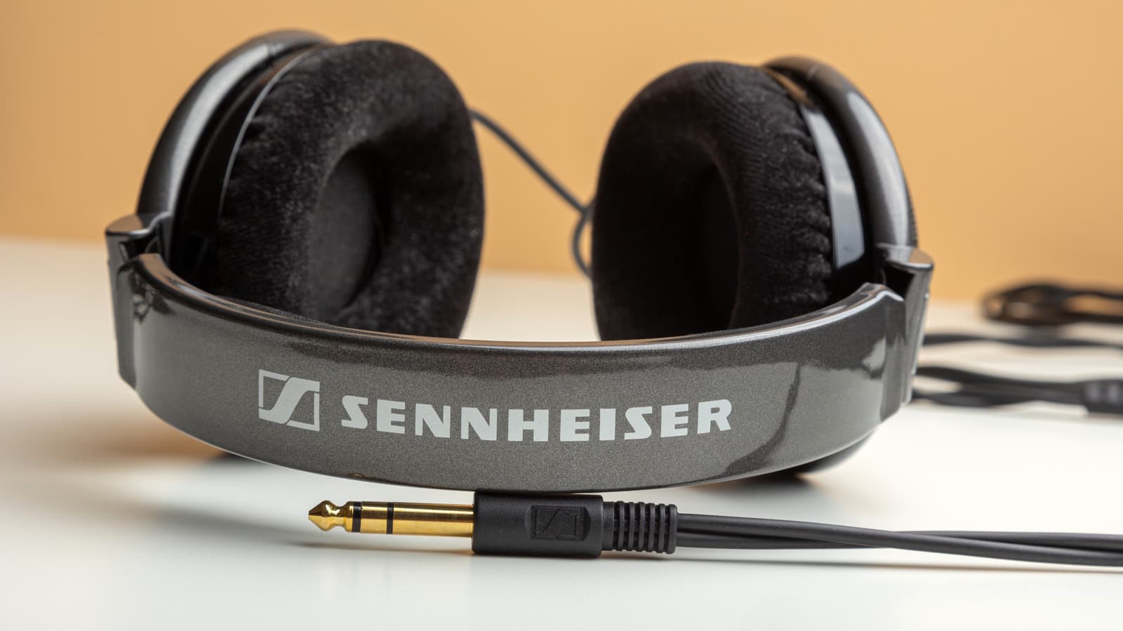 Close-up of a Sennheiser headphone with a 2.5mm twist-lock audio jack connector