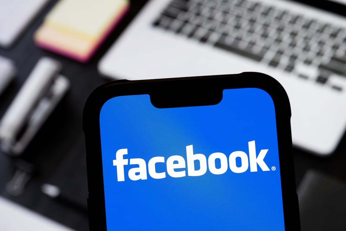 Facebook Marketplace app icon on a smartphone screen with seller verification badge visible