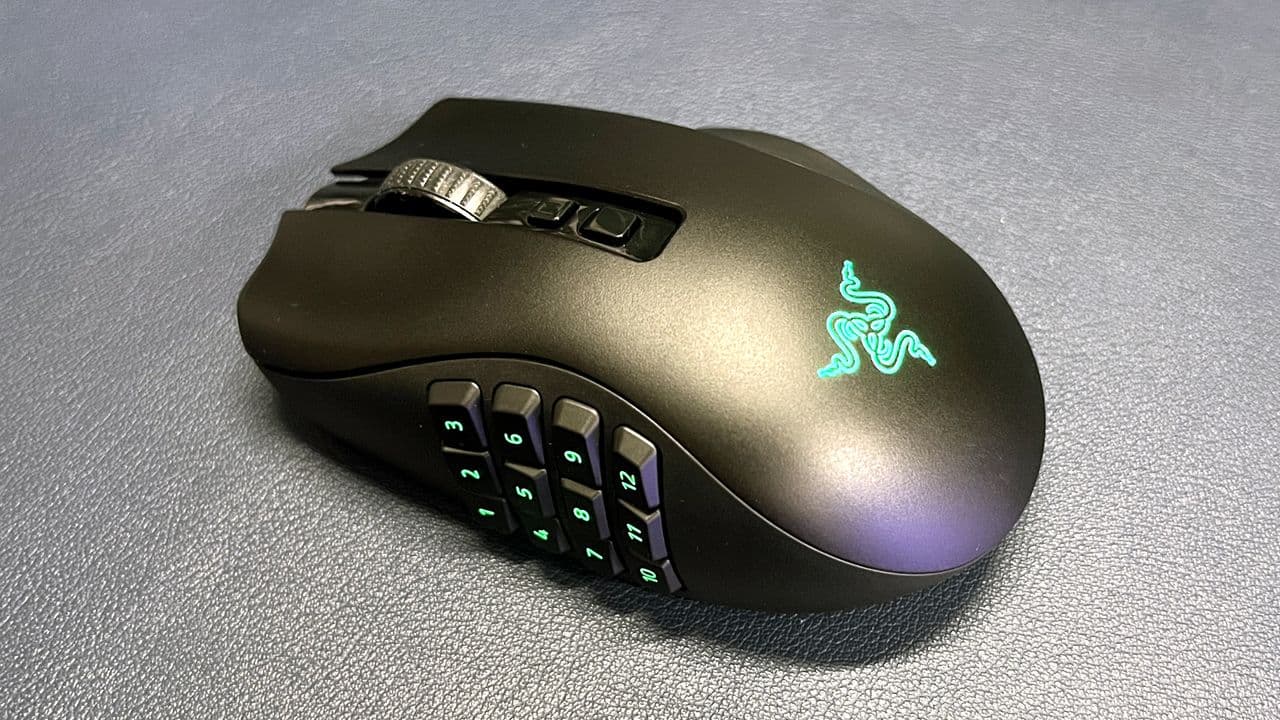 A Razer Naga gaming mouse with programmable side buttons used in a medical telehealth setting.
