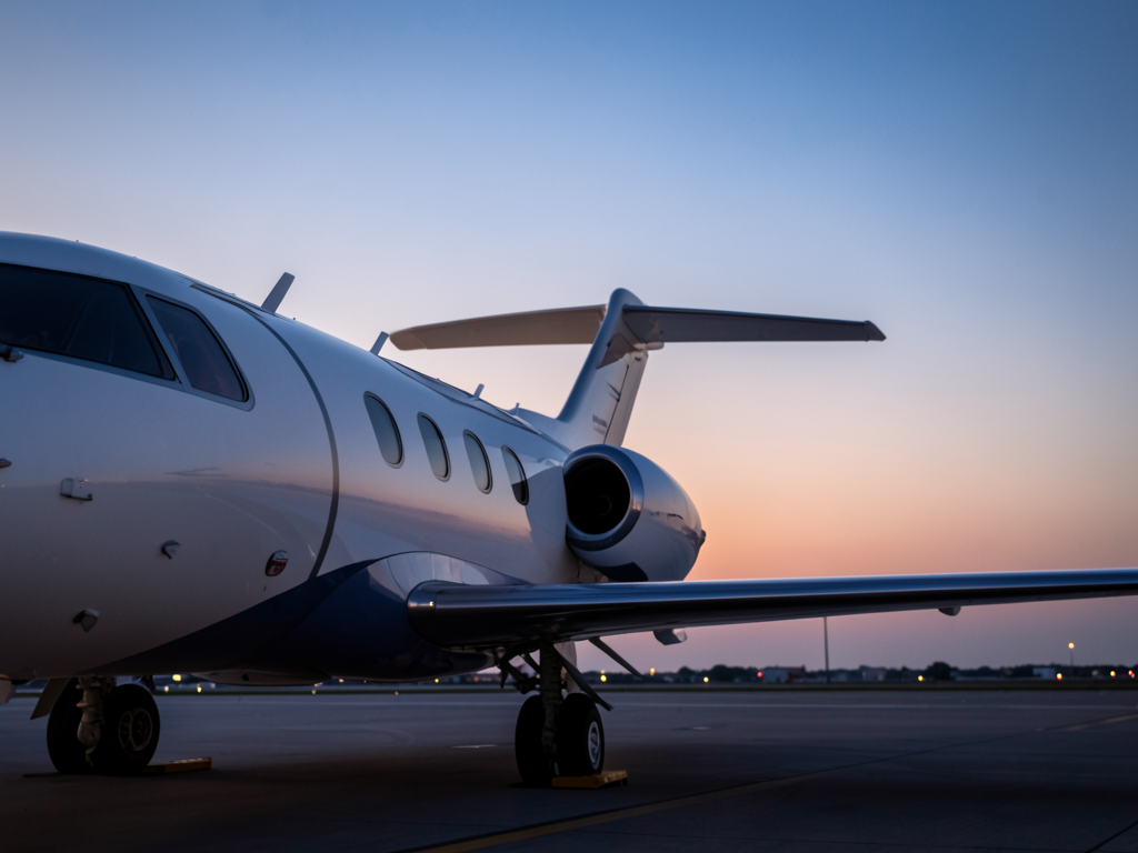 Starlink satellite dish installed on the roof of a private business jet on the tarmac