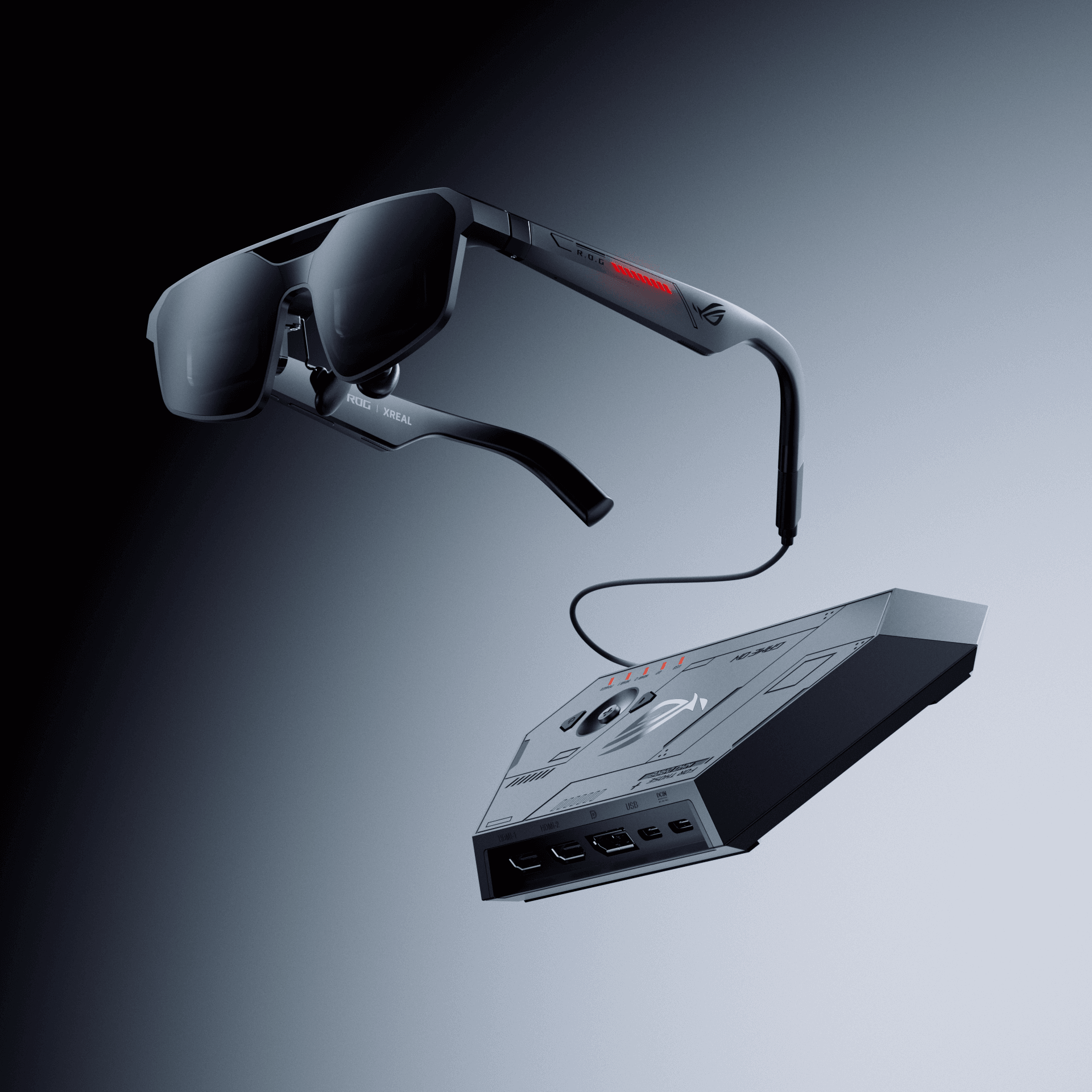 A person wearing lightweight tethered display glasses connected to a laptop, with a large virtual screen visible in front of