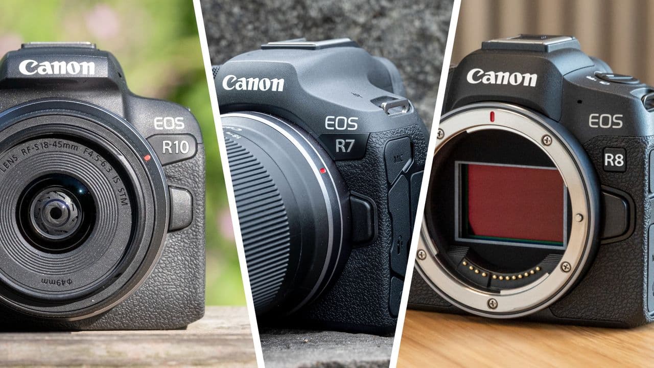 Canon EOS R8 mirrorless camera on a table with battery compartment open.