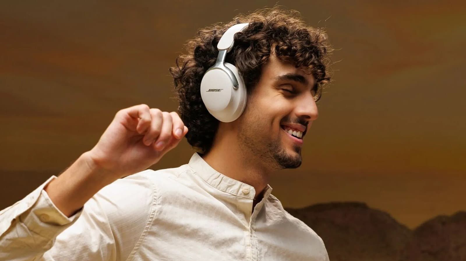 Bose QuietComfort Ultra headphones placed on a table, showcasing the sleek design and carrying case
