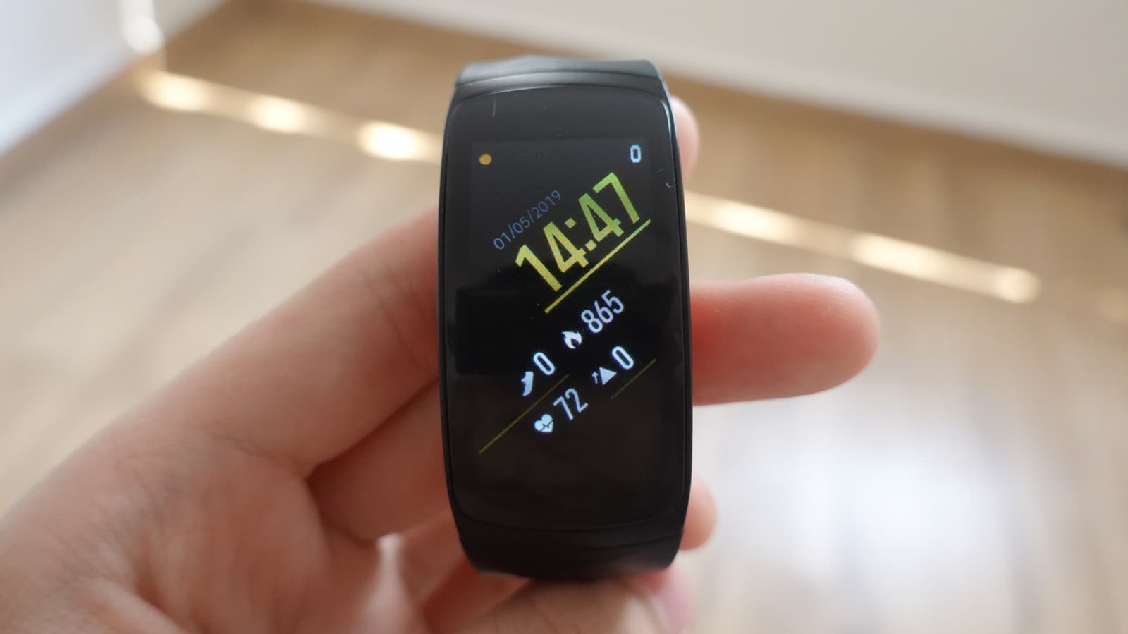 A Samsung Gear S3 smartwatch paired with an iPhone screen showing notifications