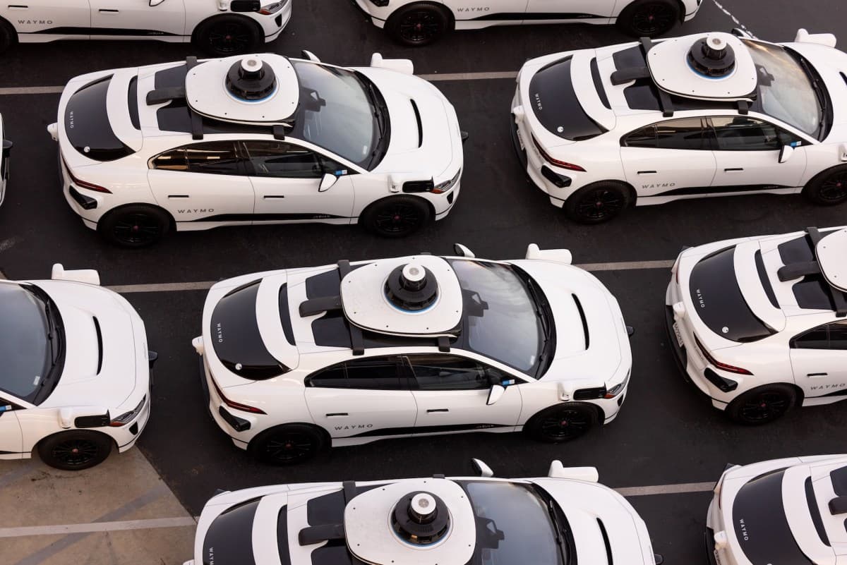 Self-driving car with sensors on a city street, representing autonomous vehicle technology and regulation