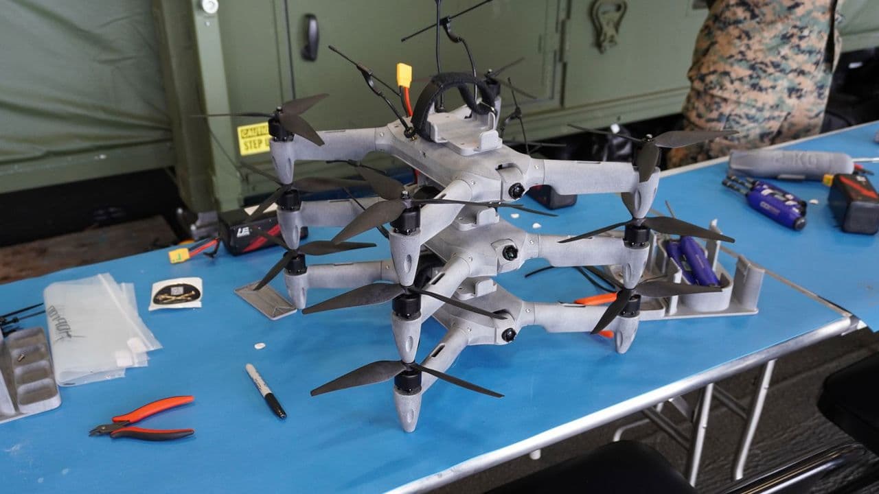 Containerized 3D printing factory aboard a US Navy ship producing drones and spare parts at sea.