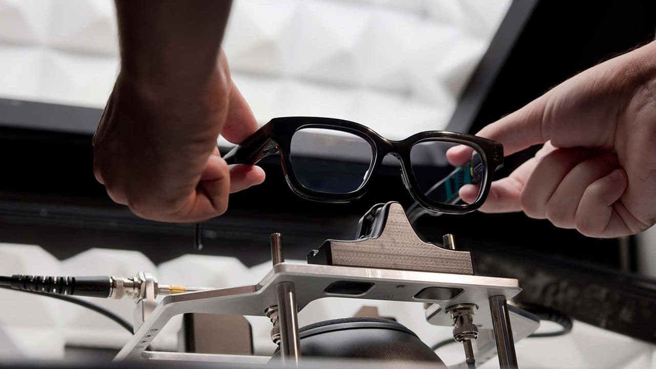 A person wearing budget smart glasses with a visible camera lens, highlighting wearable camera technology